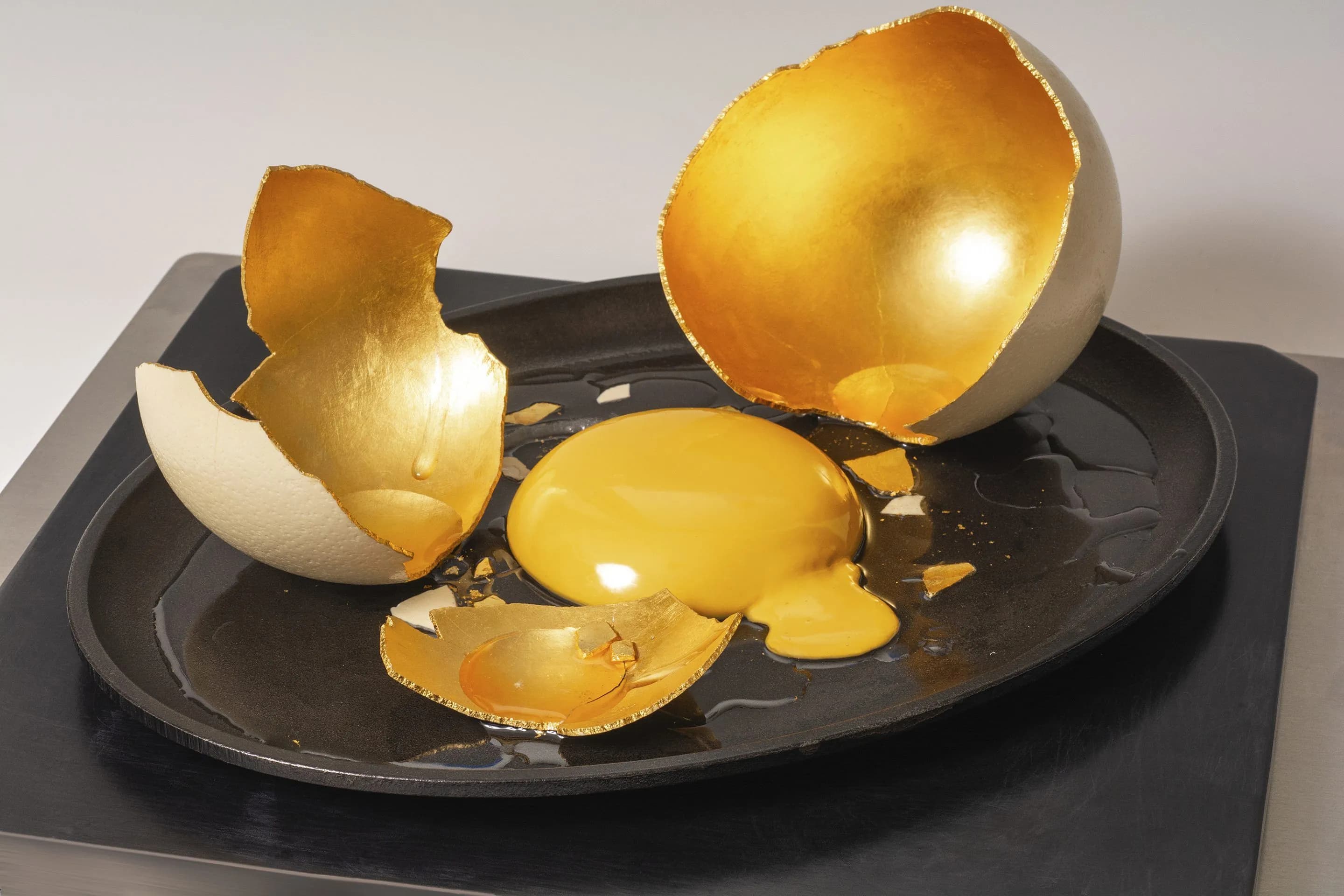 JAMES NAZZ_Golden Egg_Egg shell, gold leaf, cast iron and glass_12x15x15